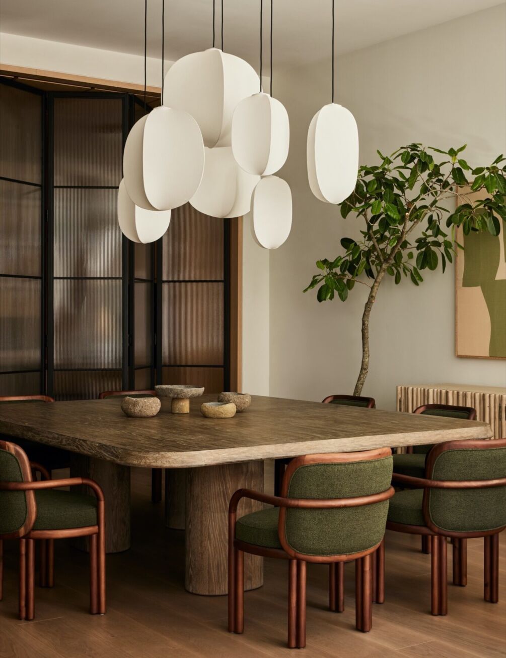 2025 Interior Design Trends: A stunning New York loft in SoHo, redesigned by Michael Ellison, blends industrial elements with warm, inviting accents. Featuring the elegant James dining chairs by Wood Tailors Club, this space embodies chic comfort and timeless craftsmanship.