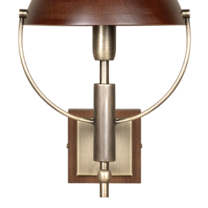 Front view of the Faraday Wall Lamp by Wood Tailors Club set against a black background, highlighting its symmetrical aged brushed brass metal frame, smoked walnut dome shade, and square base.