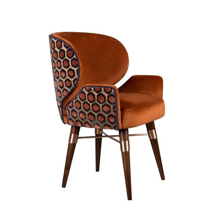 Ottiu’s newest armrest dining chair version will offer you even more comfort, highlighting the modern mid-century design. Featuring smoked walnut wood legs and upholstered in jacquard velvet and velvet, the Louis I Dining Chair will be for sure a decorative statement in your luxury décor.