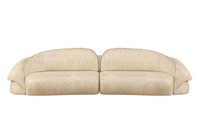 Dressed up in a deluxe bouclé fabric, the Romy sofa’s exquisite design creates an inviting and cozy seating arrangement that encourages conversation and interaction.