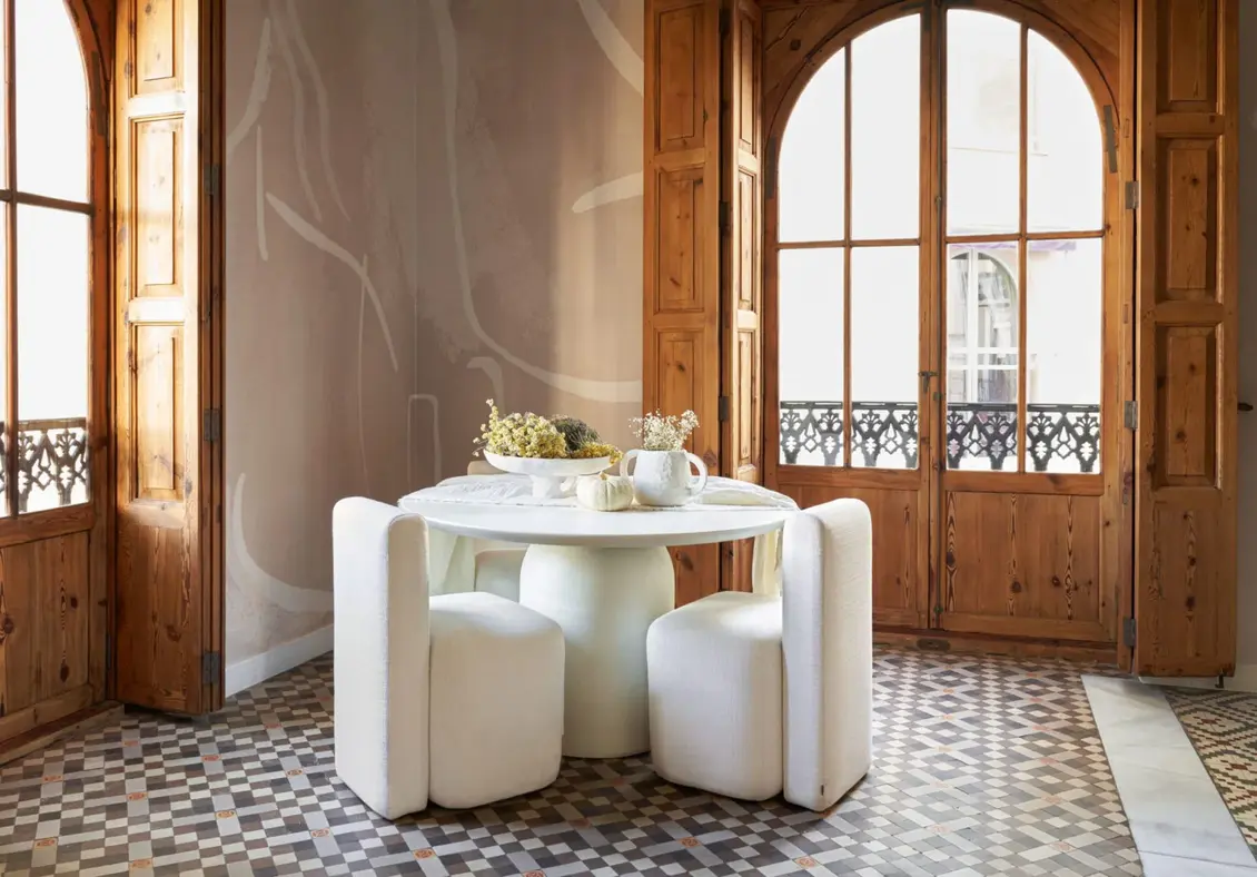 Spanish Colonial Interior Dining Room with round dining table and wood dining chairs
