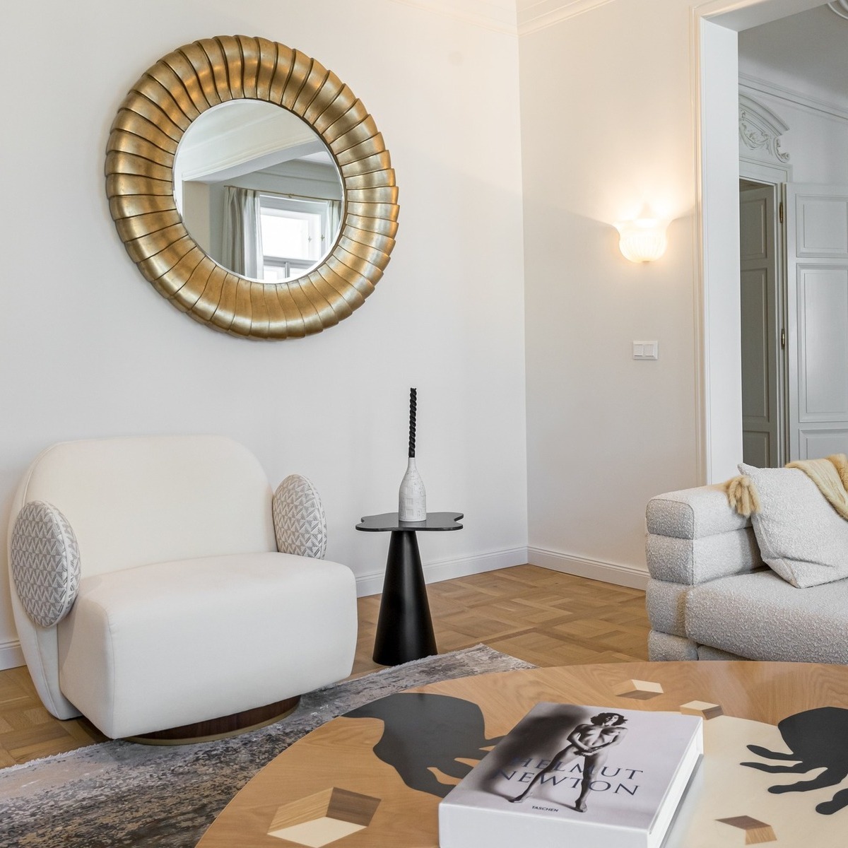 Designed by Barkarová Irina of B33 Group, this elegant Prague apartment captures a couple’s love for travel, fashion, and art. Featuring standout pieces like the James Dining Chair by Wood Tailors Club and Malabar’s La Voix Armchair and In Vij En Center Table, the space blends eclectic charm with sculptural sophistication.