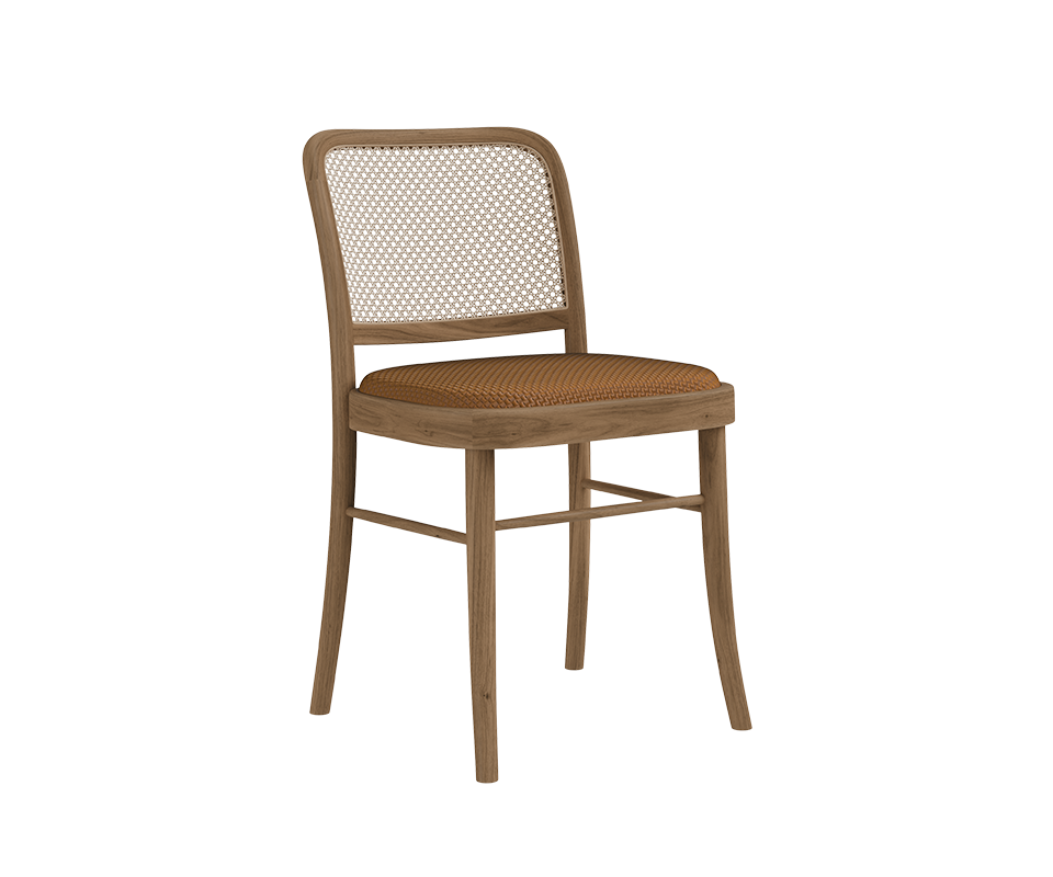 Three-quarter view of the Charles I Dining Chair by Wood Tailors Club featuring a natural light oak wooden frame, a cane rattan backrest, and a warm cognac braided leather seat.