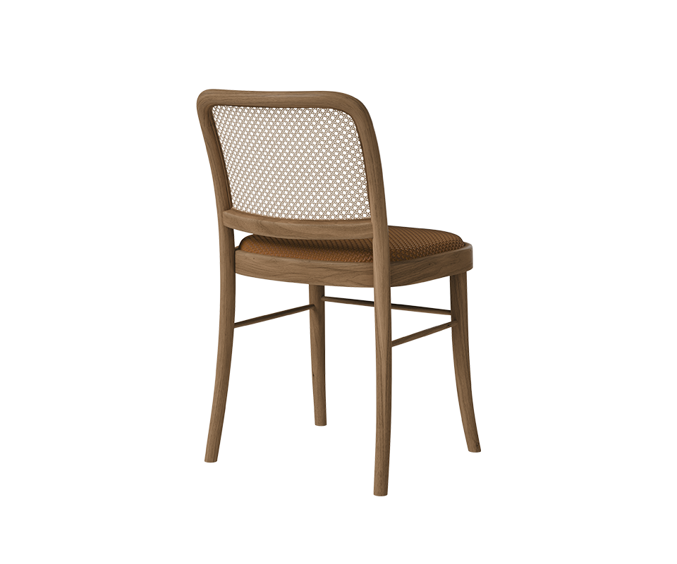 Rear three-quarter perspective of the Charles I Dining Chair showcasing the light oak wooden frame, slender legs, natural rattan back panel, and cognac braided leather upholstery.
