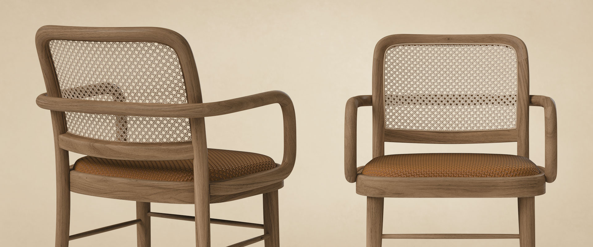 Close-up detail of two Charles II Dining Chairs by Wood Tailors Club side by side, highlighting the fine wood grain craftsmanship, rattan backrest texture, and cognac braided leather upholstery.