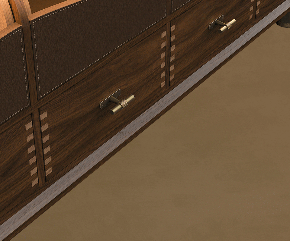 Close-up detail of the lower walnut drawers on the Edward Sideboard by Wood Tailors Club, featuring exposed dovetail joinery and T-bar brass handles with knurled detailing.