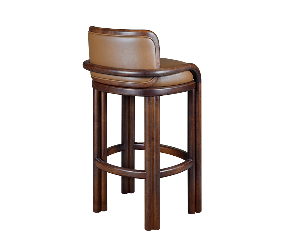 Three-quarter back view of the James Bar Chair highlighting the continuous smoked walnut wooden structure wrapping around the tan leather backrest.