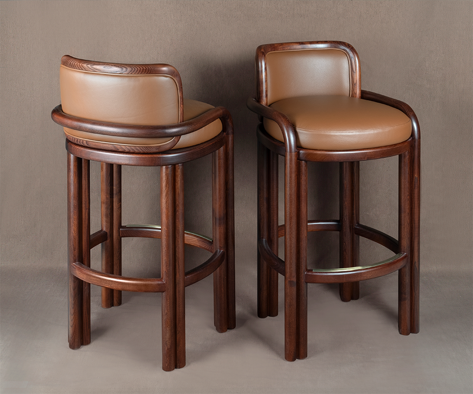 Pair of James Bar Chairs in dark smoked walnut wood and tan genuine leather, displaying front and back dynamic angles on a neutral beige background.