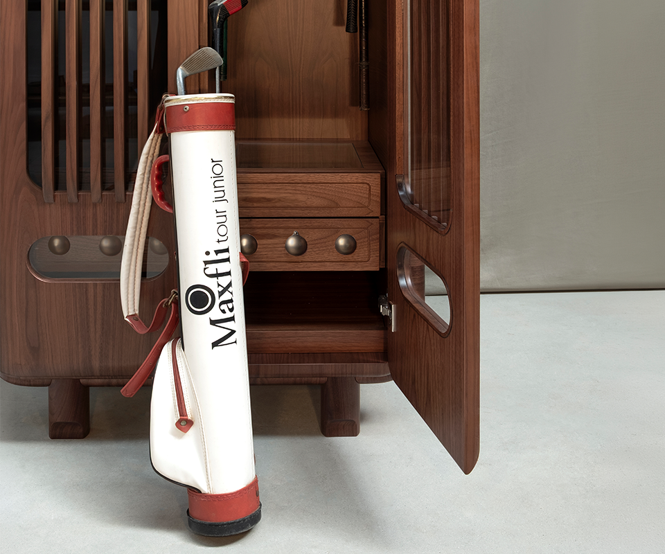 Kennedy Golf Locker A medium shot of the open smoked walnut locker base. A vintage white and red leather golf bag is placed in front, showing the scale of the interior storage compartment.