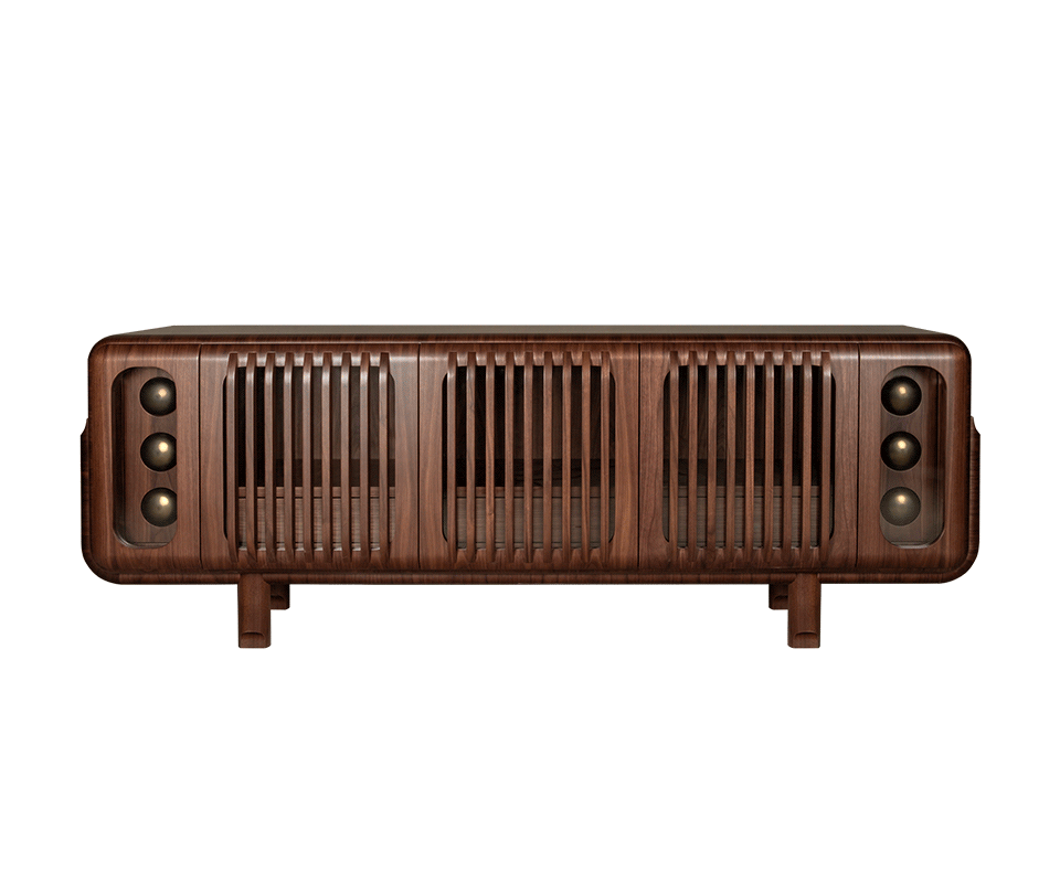 A front-facing shot of the Kennedy Sideboard in smoked walnut wood. It features a symmetrical design with three central slatted (slotted) wood panels and two outer glass-enclosed compartments showcasing three decorative spherical brass elements each. The unit has rounded edges and sits on four sturdy, short wooden legs.