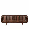 A front-facing shot of the Kennedy Sideboard in smoked walnut wood with the light turning on and off. It features a symmetrical design with three central slatted (slotted) wood panels and two outer glass-enclosed compartments showcasing three decorative spherical brass elements each. The unit has rounded edges and sits on four sturdy, short wooden legs.