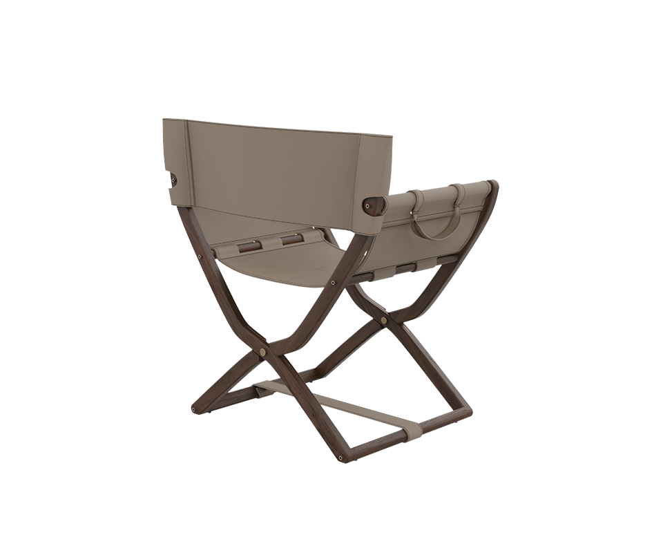 Korda Folding Chair A three-quarter rear perspective of the Korda Folding Chair, emphasizing the meticulous leather stitching on the backrest and the high-quality wood grain of the dark walnut frame.