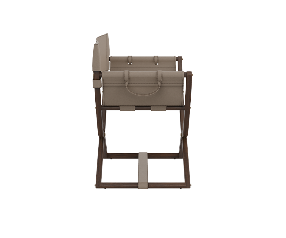 Korda Folding Chair Direct side profile of the chair, showcasing the functional leather handle attached to the frame and the precise balance between the modern silhouette and the classic director's chair inspiration.