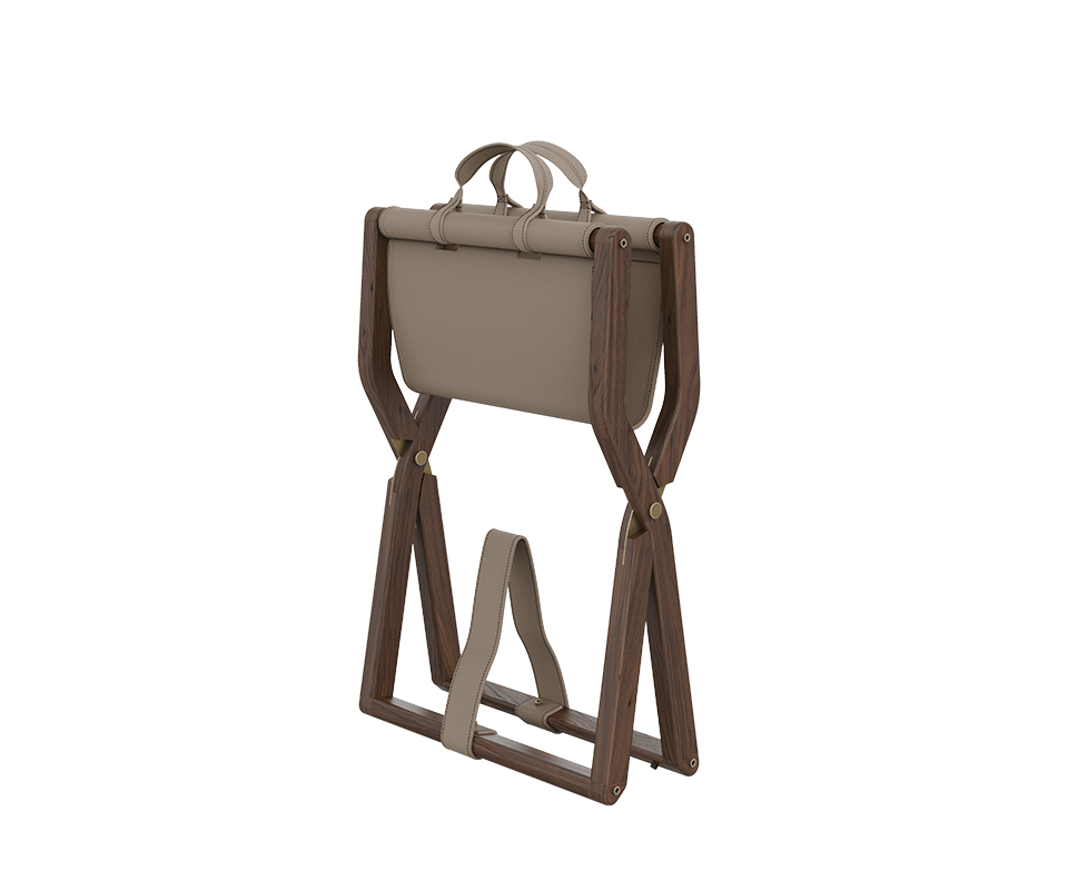 Angled view of the Korda stool in its folded position, demonstrating its portability and the functional leather carry handles at the top.