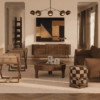 Two Korda Folding Chairs, with Director's Chair aesthetic, by Wood Tailors Club featuring dark wood frames and beige leather upholstery, arranged in a sophisticated, mid-century modern living room with a neutral color palette.