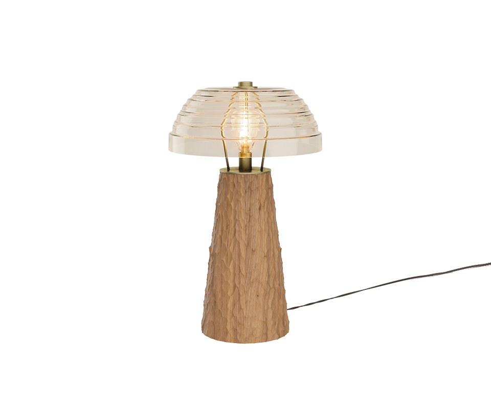 A studio shot of the Lloyd I Table Lamp with a light-colored natural oak hammered base, a brass structural core, and a clear horizontally-grooved glass shade.