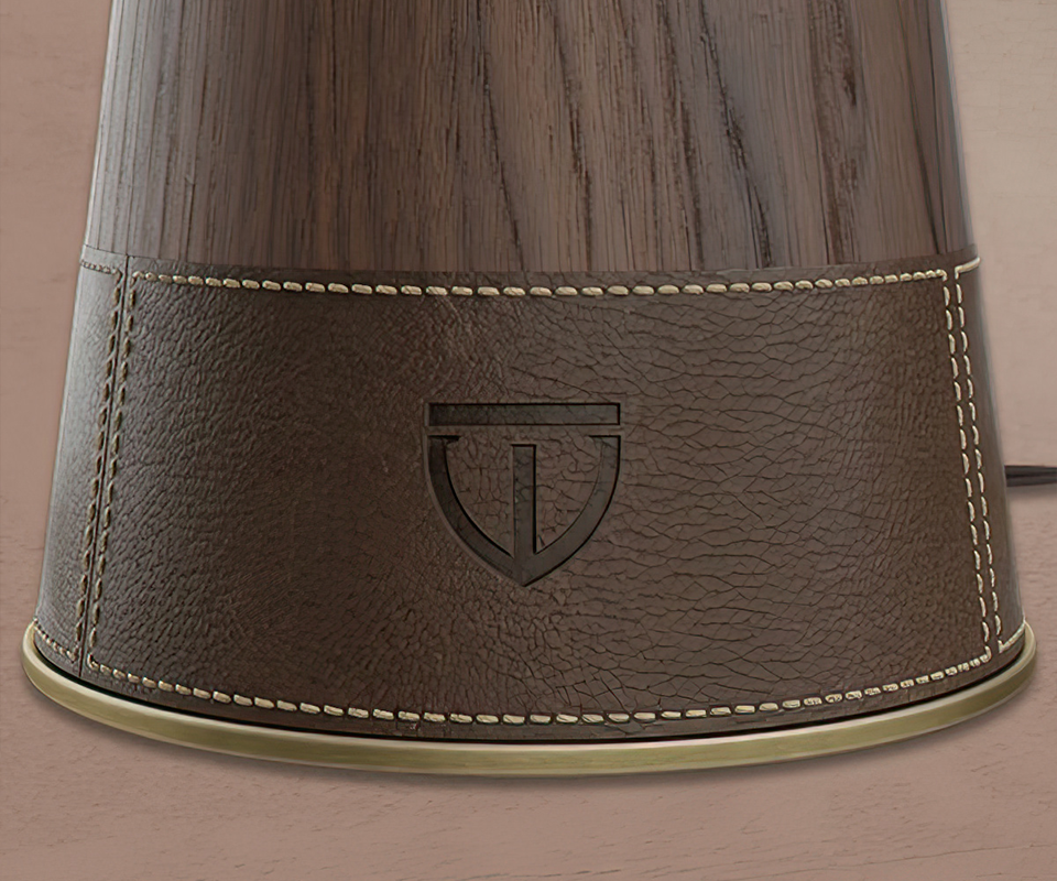 Lloyd II Table Lamp close-up showcasing the leather texture and the brand's logo