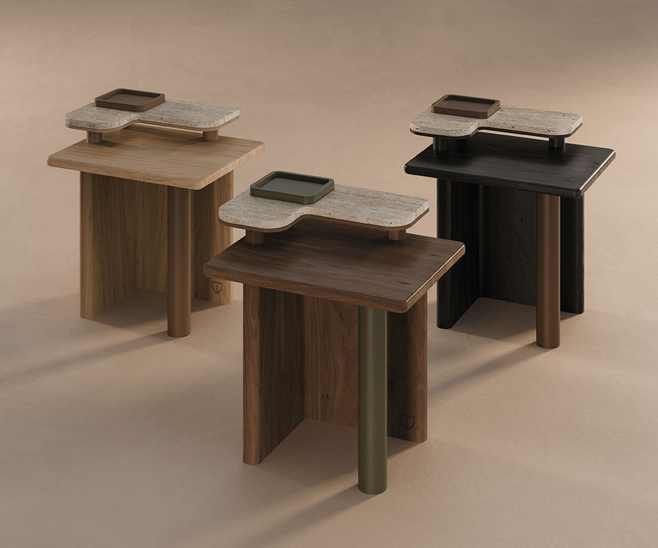 Three Maurier side tables set against a cream background, one crafted in oak, another in smoked walnut, and the last in black-stained ashwood.