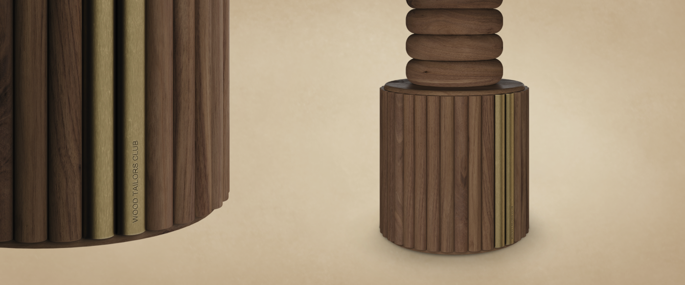 Close-up detail of the Stuart II Dining Table pedestal base by Wood Tailors Club, highlighting the vertical fluted wooden slats, aged brass accents, and engraved brand logo.